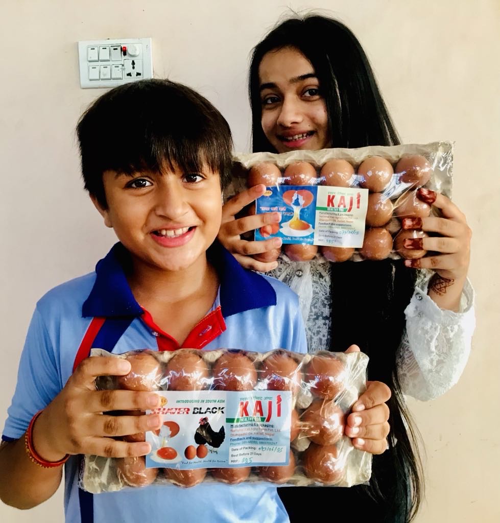Customers holding packs of Kaji Eggs.